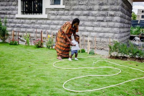 Image of Ruth Namachanja playing with her kid